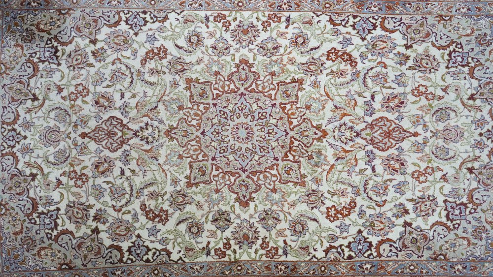 A fine part silk Esfahan rug, Persian, the ivory field with a brown shaped medallion, - Image 2 of 5