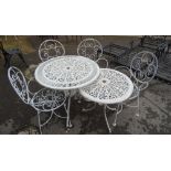 A set of five 20th century white painted wire work open armchairs, a similar circular garden table,
