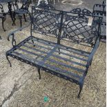 Forecast Furniture LTD; a pair of black painted metal garden benches, 122cm wide x 84cm high, (2).