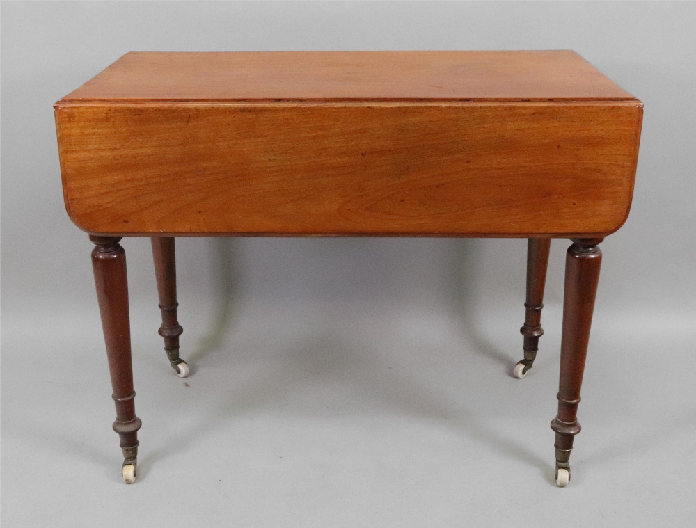 A Victorian mahogany Pembroke table, on