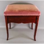 An Edwardian mahogany piano stool, label