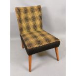 A retro upholstered T.V. chair, 49cm wid
