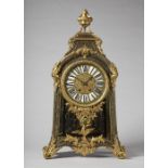 An ormolu-mounted, tortoiseshell and cut brass-inlaid mantel clock In the Louis `XIV style,