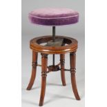 A Regency mahogany piano stool, the circular height adjustable top on four splayed turned supports,