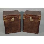 A pair of two-tone leather covered trunks of recent manufacture,