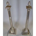 Indian Jane; pair of 20th century chrome table lamps formed as Corinthian columns, 85cm high, (2).
