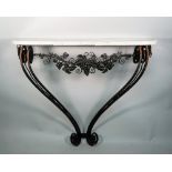 A French Art Deco console, the marble top on fruiting vine chased dual wrought iron scroll supports,