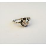 A diamond set and white metal single stone ring, the old mine cut diamond,