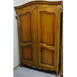 A 20th century walnut Continental style two door wardrobe on cabriole supports,