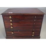 A 19th century mahogany seven drawer table top collector's chest, 37cm wide x 28cm high.