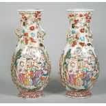 A pair of Chinese export mandarin palette two-handled vases, Qianlong,