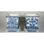 A pair of Chinese blue and white porcelain jardinieres and stands, late 19th century,