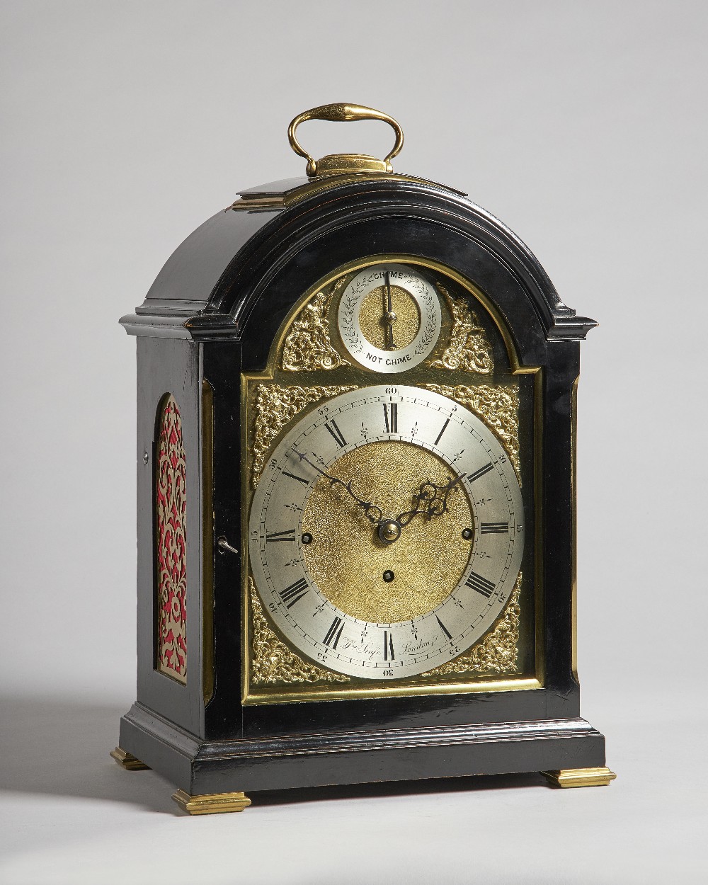 An Edwardian brass-mounted ebonised quarter chiming bracket clock The dial inscribed Wm.