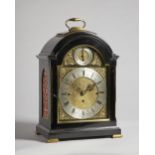 An Edwardian brass-mounted ebonised quarter chiming bracket clock The dial inscribed Wm.