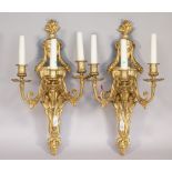 A pair of Empire style ormolu three light wall appliques, 20th century,