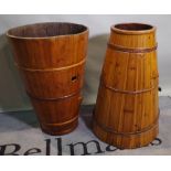 A pair of 20th century pine buckets of tapering form, 56cm wide x 60cm high, (2).