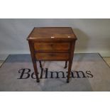 A 19th century Dutch mahogany and brass inlaid two drawer side table on tapering square supports,