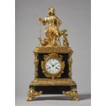 A French giltmetal and black marble mantel clock Circa 1860 Modelled with a seated figure of a