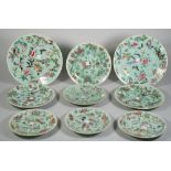 A group of fifteen Chinese celadon-ground plates, 19th century, in four sizes,