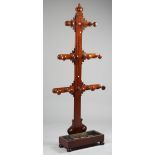 A Victorian Gothic mahogany three tier hall stand with turned hooks and rectangular drip tray,