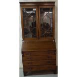 An Edwardian mahogany bureau bookcase with astragal glazed doors over four long graduated drawers