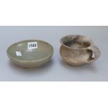 A Chinese Yue ware celadon glazed shallow bowl, 8th/9th century, (a.f), 14.5cm.