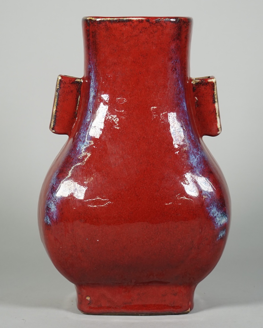 A Chinese flambé vase ( Hu), Yongzheng seal mark but later, of pear form with lug handles,