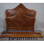 A late 19th century French walnut arch topped double bed, on acanthus carved cabriole supports,