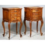 A pair of French walnut serpentine three drawer bedside tables of Louis XV style,