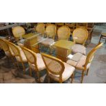 A 20th century oak and glass dining table with bevelled rectangular glass top on two oak pedestal