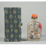 A Chinese inside painted glass snuff bottle, 20th century, painted on one side with a St.