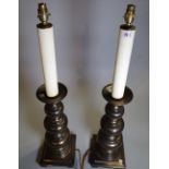 A pair of 20th century bronzed metal table lamps of turned form, 83cm high, (2).