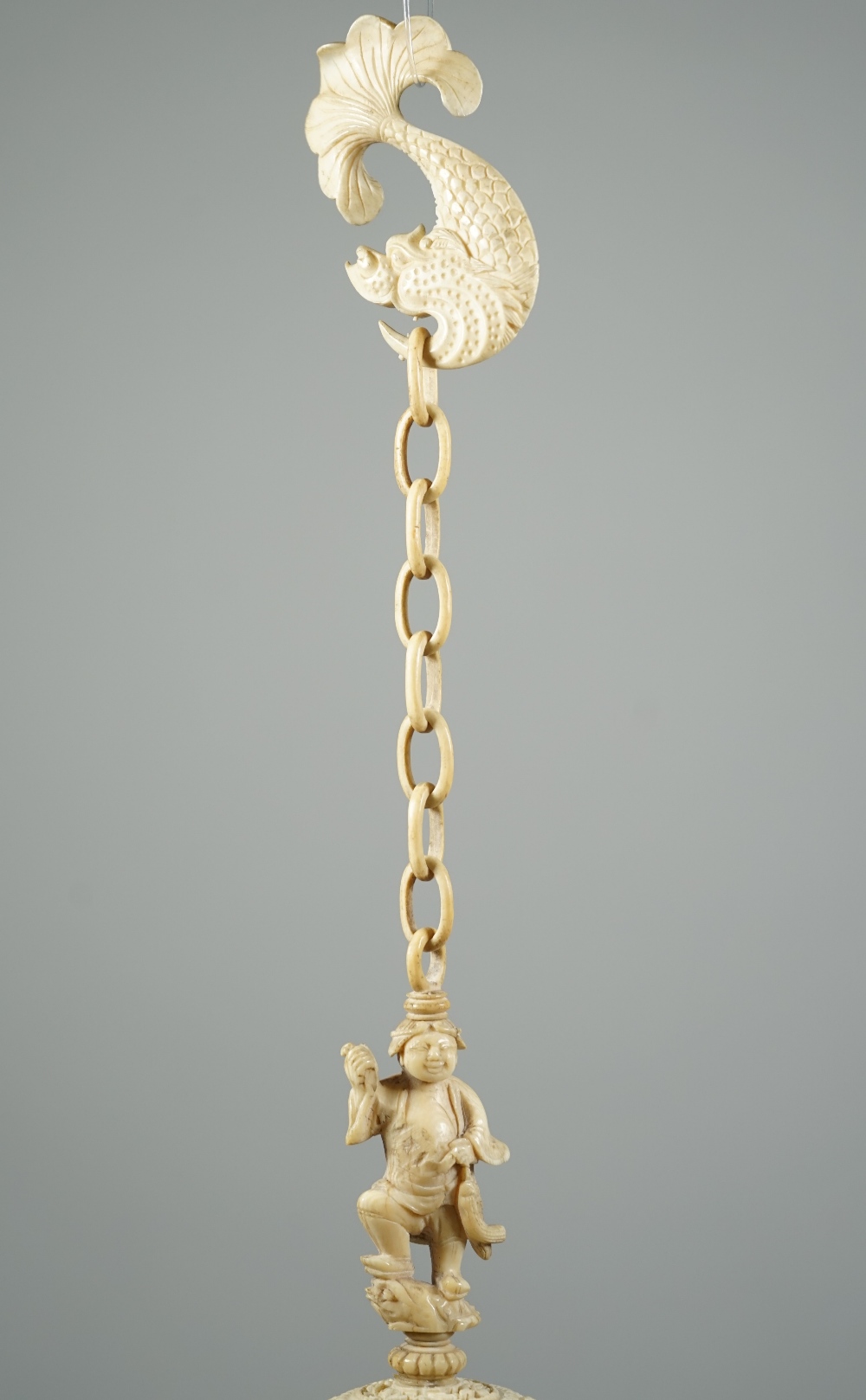 A Canton ivory puzzle ball, late 19th century, the outer ball pierced and carved with figures, - Image 5 of 6