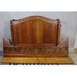 A late Victorian oak and walnut single bed, 128cm wide x 110 high.