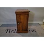 A George III mahogany and satinwood banded bedside cupboard on plinth base,