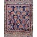 An Afshar rug, South Persian, the indigo field with rows of boteh flowerheads,