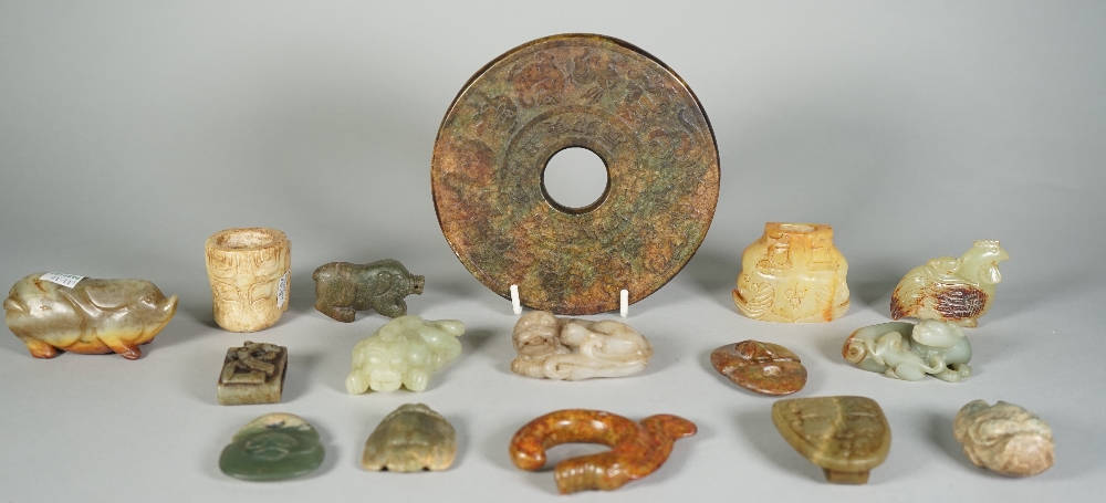 A group of Chinese archaistic jade carvings, of various colour and size,