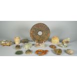 A group of Chinese archaistic jade carvings, of various colour and size,