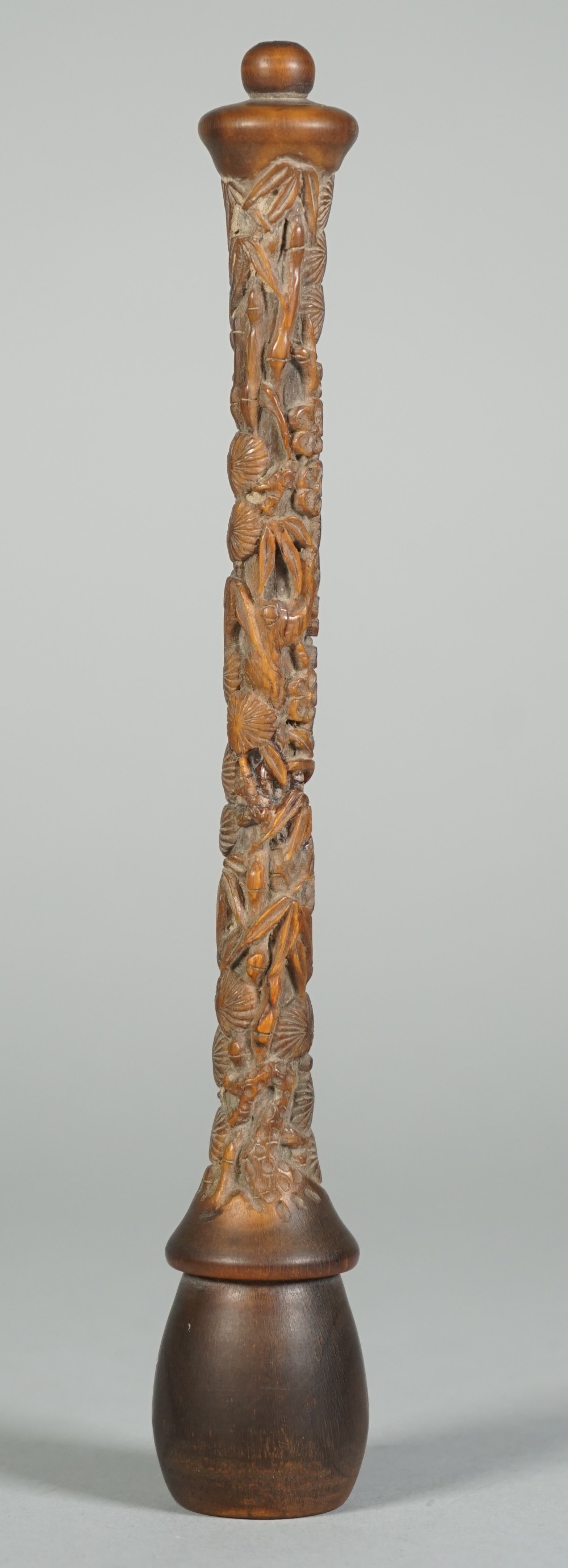 A Chinese rhinoceros horn fly whisk handle, 19th century, carved with bamboo, pine and prunus, 21cm. - Image 2 of 4
