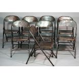 Industrial Design; a set of eight polished steel tubular framed folding chairs,