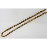 A 9ct gold faceted curb link neckchain, on a sprung hook shaped clasp, length 50cm, weight 60.5 gms.