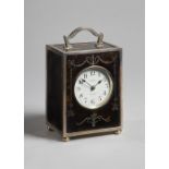 An Edwardian silver and tortoiseshell carriage clock London 1909 The rectangular case with a shaped