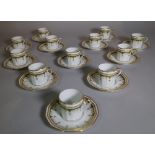 A modern Limoges gilt and green coffee set, retailed by Asprey,
