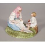 A Russian biscuit porcelain figure group of mother and child, Gardner factory, late 19th century,