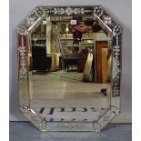 An early 20th century Venetian style octagonal wall mirror with bevelled glass,