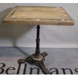 A 20th century cast iron and oak top centre table, 70cm wide x 76cm high.