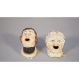 A pair of mid-19th century Staffordshire figural inkwells,