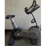 Techno Gym; an upright exercise bike.