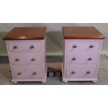 Chalon; a pair of 20th century mahogany bedside chests with three short drawers on bun feet,
