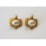 A pair of mabé pearl and diamond set yellow precious metal earclips of rectangular design,